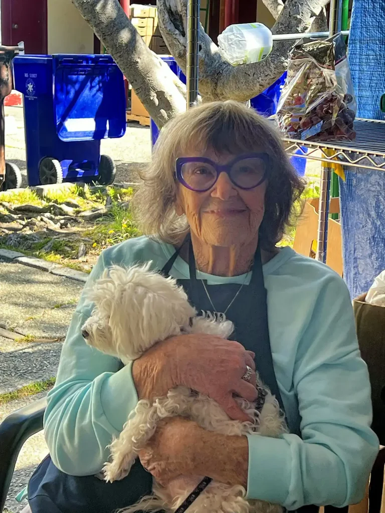 Old lady holding small dog