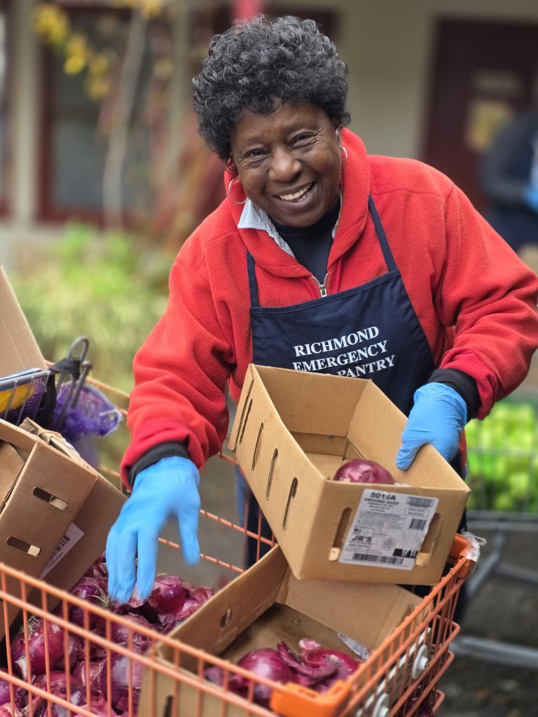 Volunteer selecting an onion